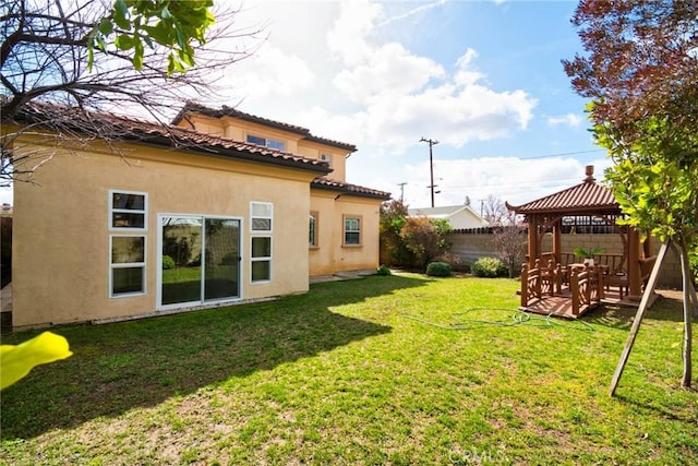 view of yard featuring a gazebo and fence private yard