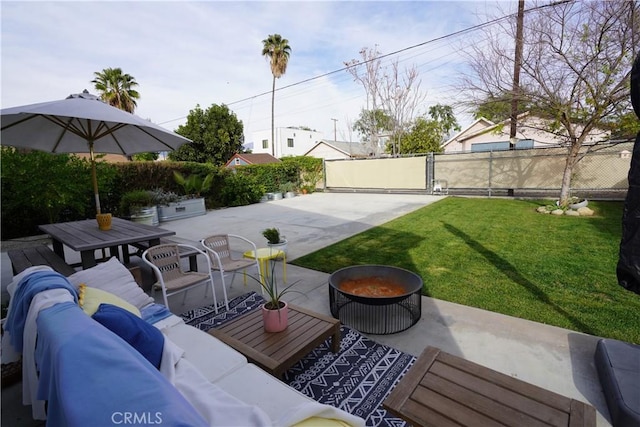 view of patio / terrace featuring a gate, fence, and outdoor lounge area