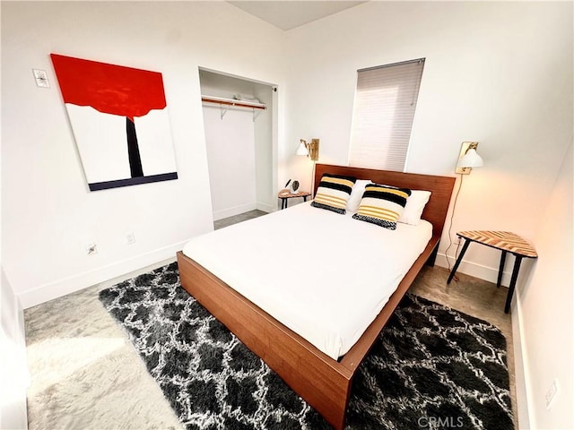 bedroom featuring a closet and baseboards