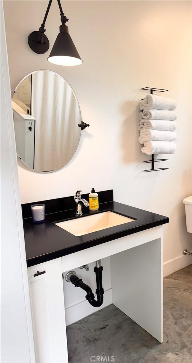 bathroom featuring a sink and toilet