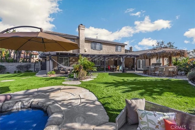 back of property featuring a chimney, a patio area, a pergola, and outdoor dry bar