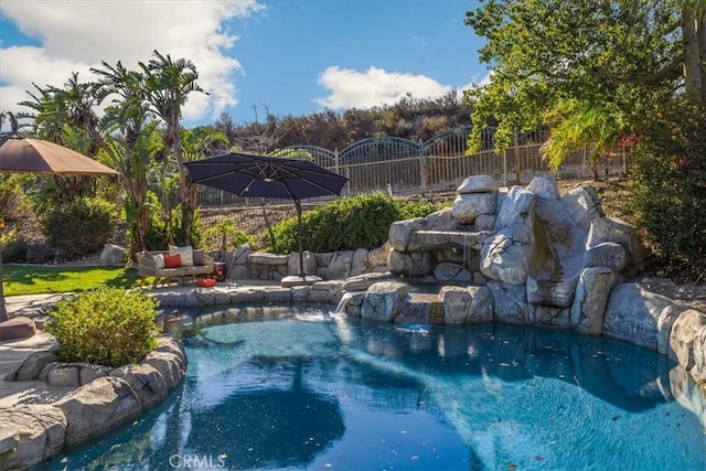 view of pool with fence