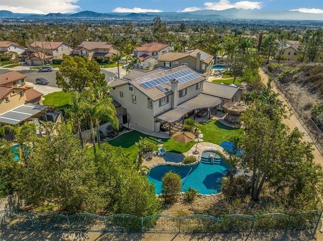 birds eye view of property featuring a mountain view and a residential view