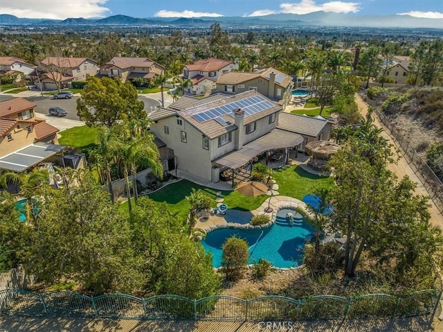 birds eye view of property featuring a mountain view and a residential view