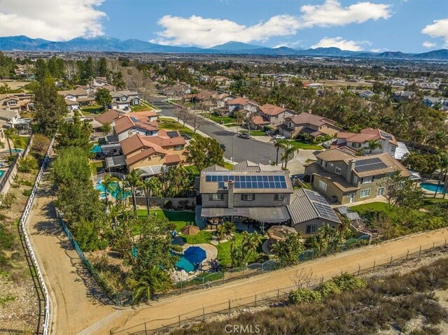 drone / aerial view featuring a residential view and a mountain view