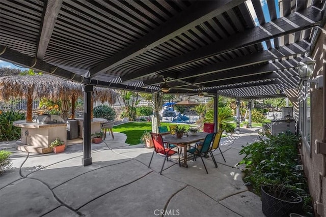 view of patio featuring area for grilling, a pergola, and outdoor dining area