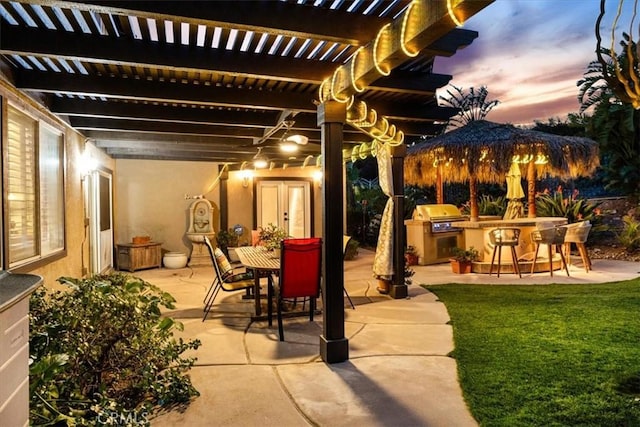 view of patio / terrace with a pergola, area for grilling, outdoor dining area, and outdoor dry bar