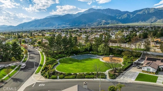 birds eye view of property with a mountain view and a residential view