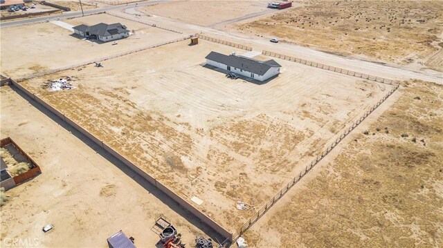 birds eye view of property featuring a desert view