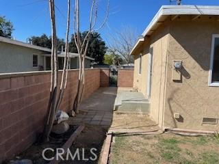 view of side of property featuring fence