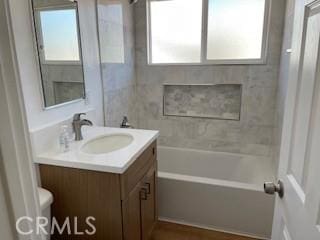 bathroom with toilet and vanity