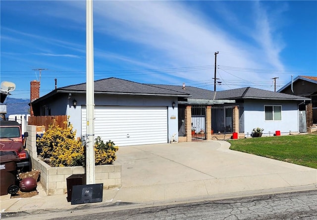 single story home with driveway, an attached garage, fence, a front lawn, and stucco siding