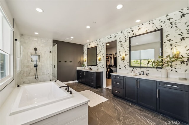 full bathroom with marble finish floor, recessed lighting, a stall shower, a sink, and a bath