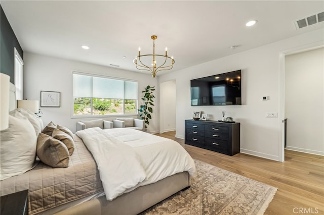 bedroom featuring baseboards, recessed lighting, visible vents, and light wood-style floors