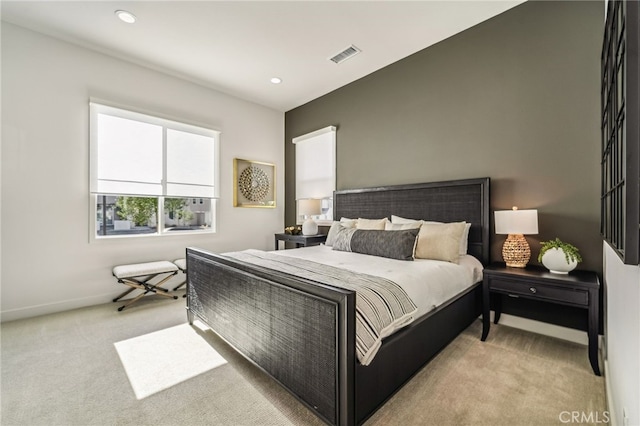 bedroom featuring carpet floors, recessed lighting, visible vents, and baseboards