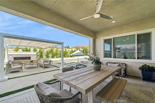 view of patio with an outdoor living space, a ceiling fan, and outdoor dining space