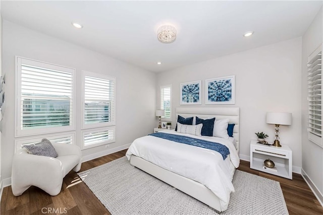 bedroom with dark wood-style floors, recessed lighting, and baseboards