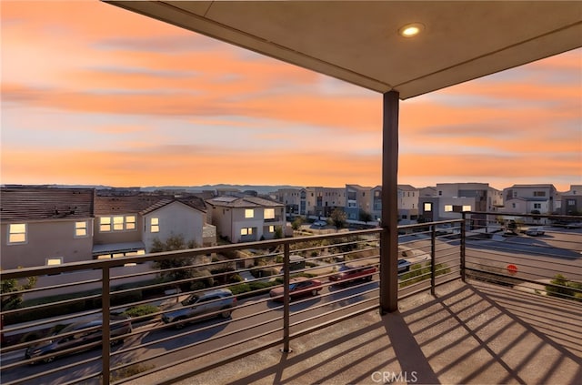 balcony at dusk with a residential view