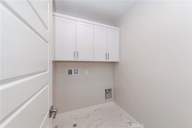 washroom with hookup for a washing machine, hookup for an electric dryer, baseboards, marble finish floor, and cabinet space