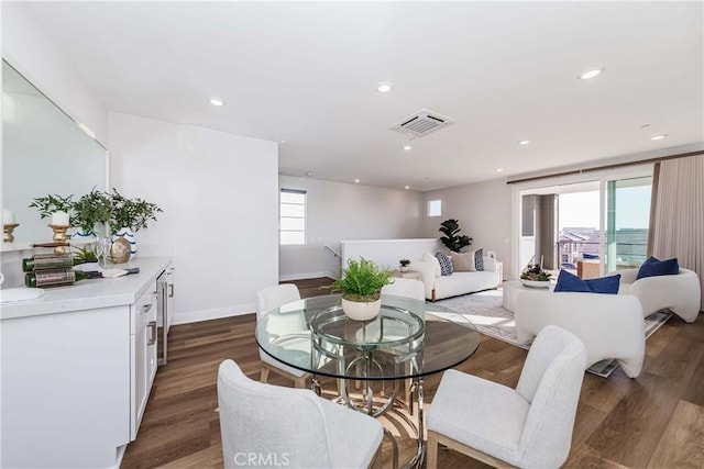 dining area featuring visible vents, wood finished floors, and recessed lighting