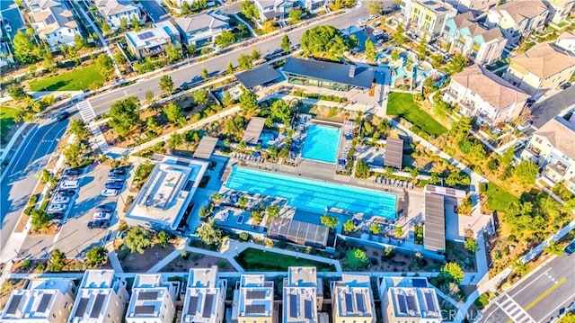 birds eye view of property with a residential view