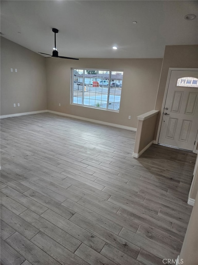 foyer entrance with recessed lighting, wood finished floors, a ceiling fan, and baseboards