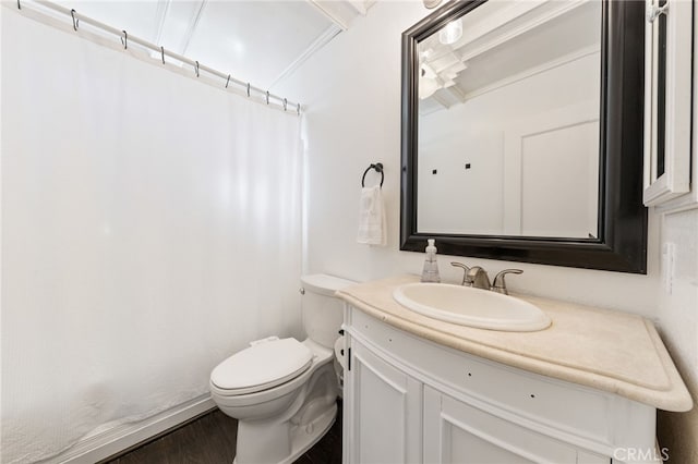 bathroom with a shower with shower curtain, vanity, toilet, and wood finished floors