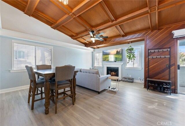 dining room with light wood finished floors, baseboards, and a wealth of natural light