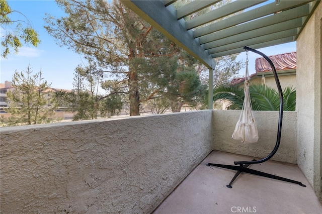 balcony featuring a pergola