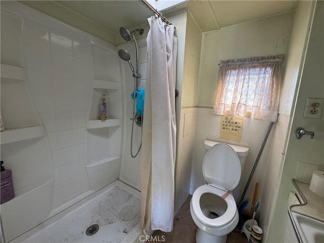 full bathroom featuring toilet, a shower stall, and tile walls