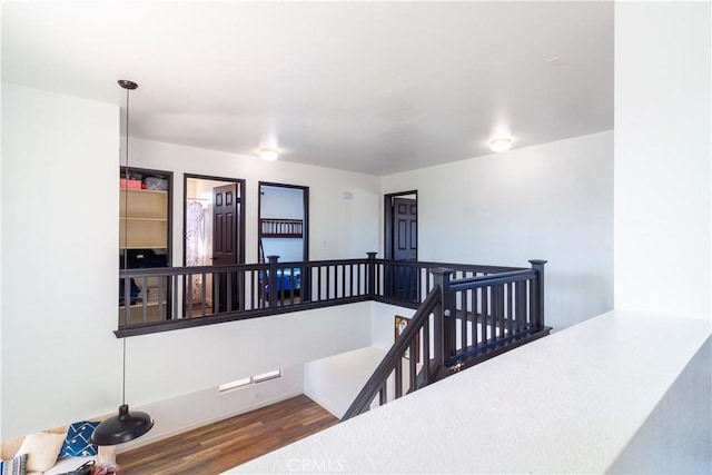 staircase featuring wood finished floors