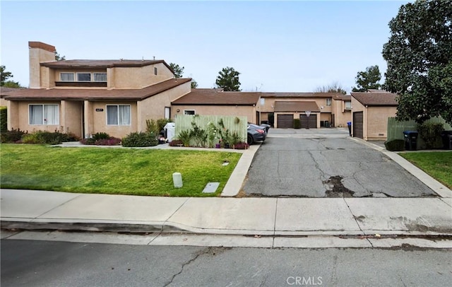 view of front of property with stucco siding and a front yard