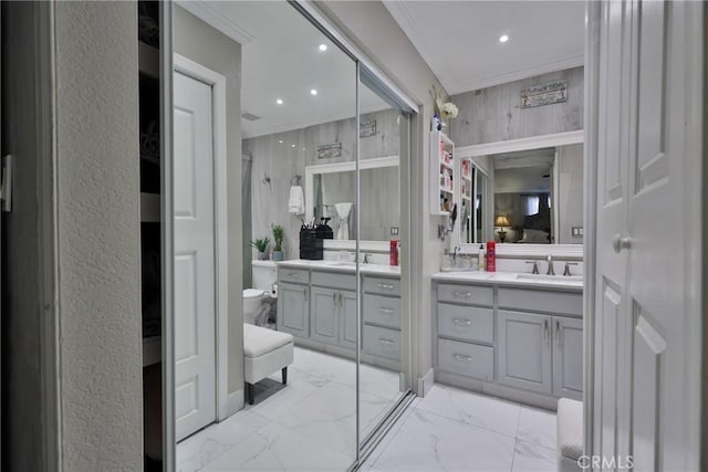 full bath featuring marble finish floor, recessed lighting, toilet, ornamental molding, and vanity