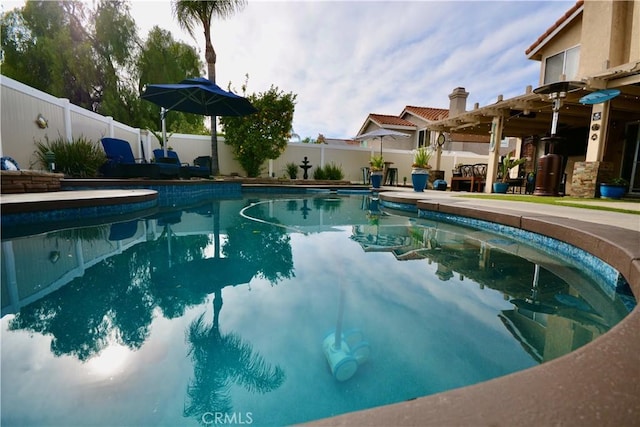 view of swimming pool with a fenced in pool and a fenced backyard