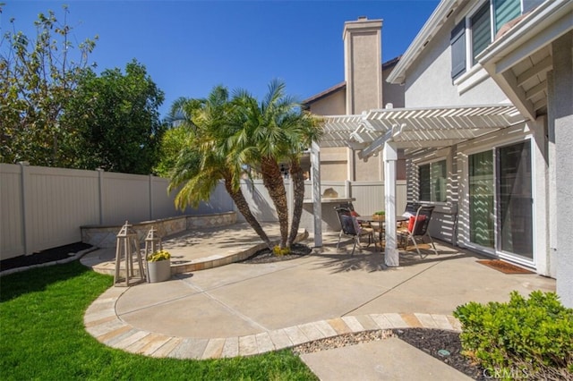 view of patio / terrace featuring a fenced backyard and a pergola