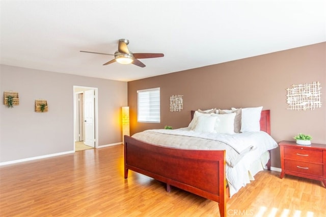 bedroom featuring light wood-type flooring, ceiling fan, and baseboards