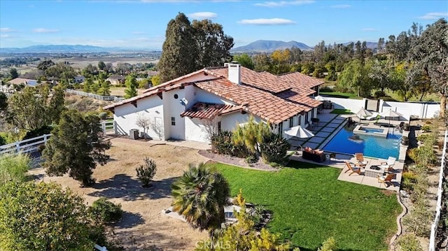 birds eye view of property with a mountain view