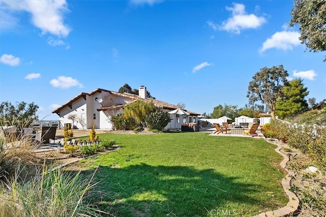 view of yard with a patio and fence