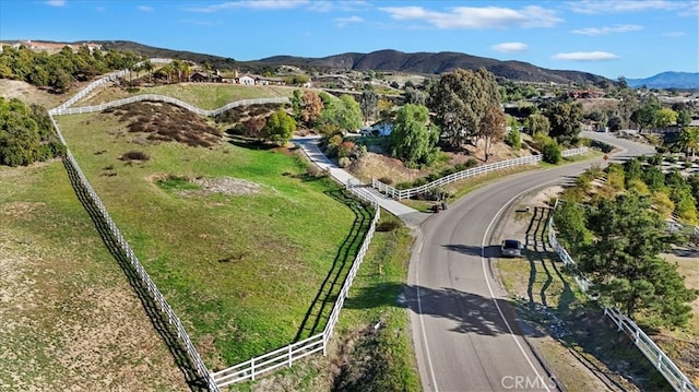 birds eye view of property with a mountain view