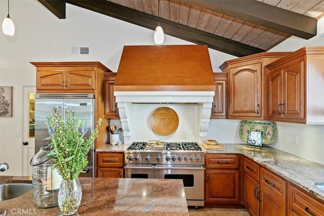 kitchen with vaulted ceiling with beams, premium range hood, high end appliances, and visible vents