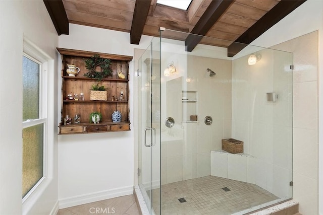 full bath featuring beam ceiling, a shower stall, wooden ceiling, baseboards, and tile patterned floors