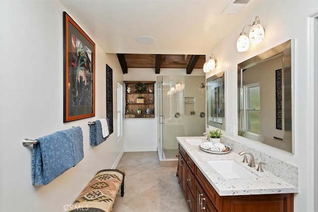 bathroom featuring a stall shower, visible vents, a sink, and beamed ceiling