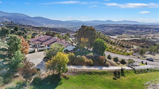 birds eye view of property with a mountain view