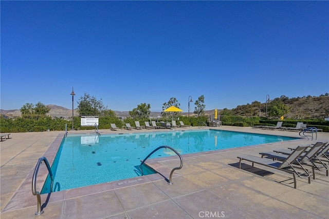 pool featuring a patio area