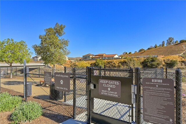 view of gate featuring fence