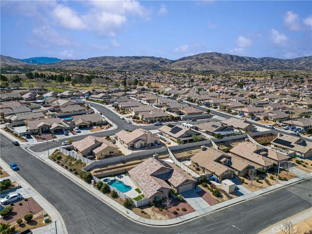 drone / aerial view featuring a residential view and a mountain view