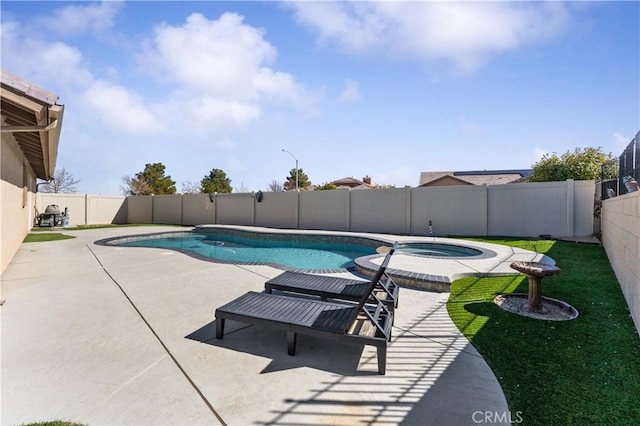 view of swimming pool with a patio, a fenced backyard, and a pool with connected hot tub