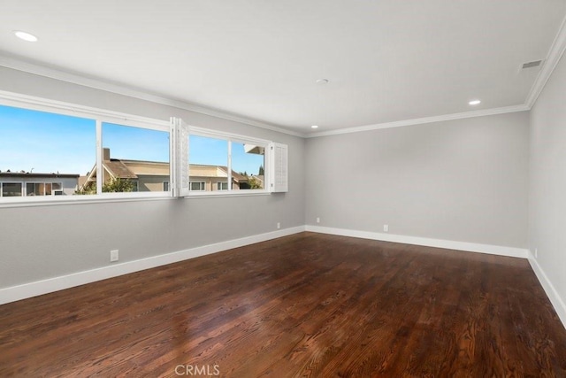 spare room with recessed lighting, wood finished floors, visible vents, baseboards, and crown molding