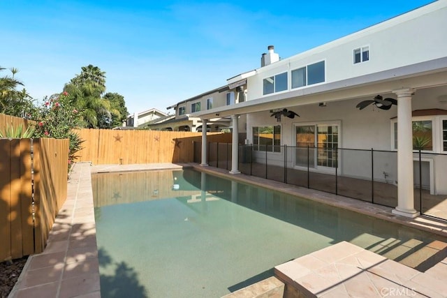 view of pool featuring a fenced in pool, a patio area, a fenced backyard, and ceiling fan