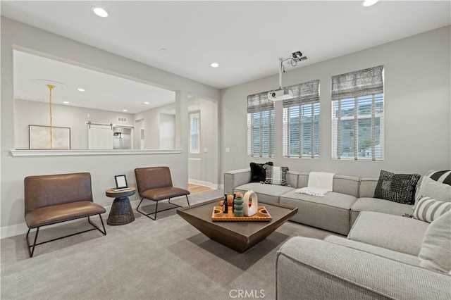 carpeted living room with recessed lighting and baseboards